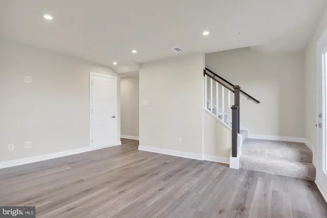 a view of entryway with wooden floor