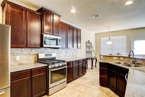 2723 Intrepid Trail Rosenberg, TX 77471 - Photo 14 of 30 The kitchen cabinets provide unmatched storage space!