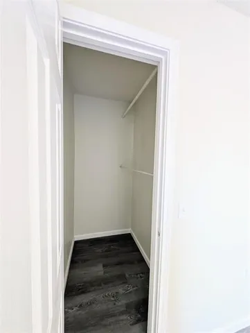 a view of hallway with wooden floor