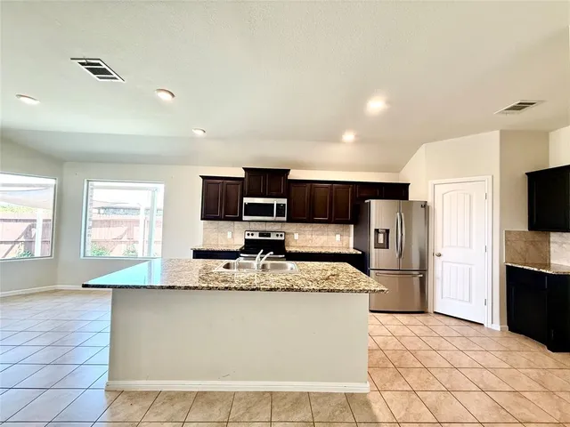 a view of a big room with wooden floor