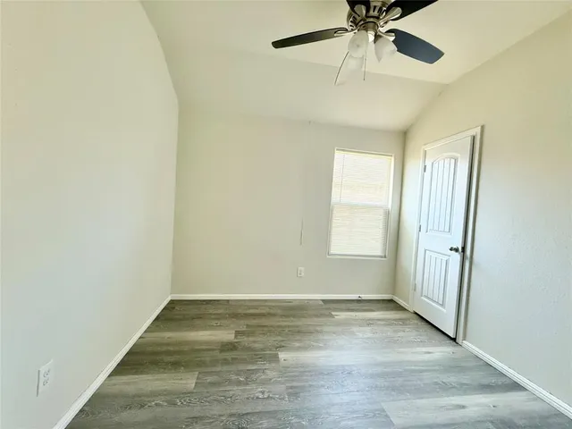 a bathroom with a tub sink double vanity and shower