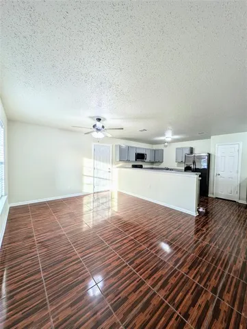 a view of kitchen with microwave and window
