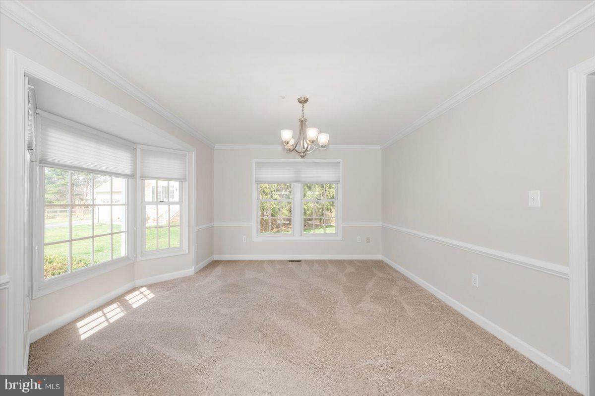 17900 Hickman Street Poolesville, MD 20837 - Photo 11 of 97 a view of an empty room with a window