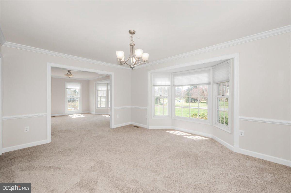 17900 Hickman Street Poolesville, MD 20837 - Photo 12 of 97 a view of an empty room with a window