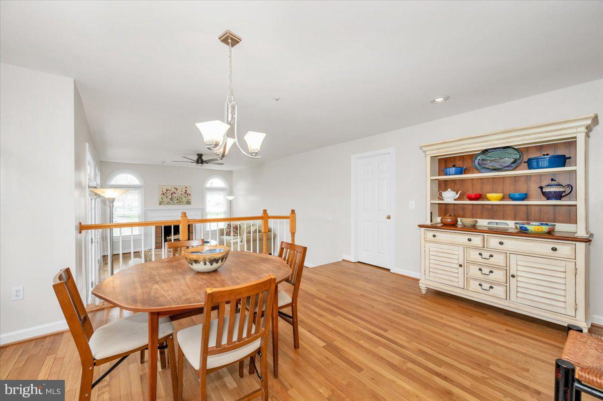 17900 Hickman Street Poolesville, MD 20837 - Photo 23 of 97 a view of a dining room with furniture window and wooden floor