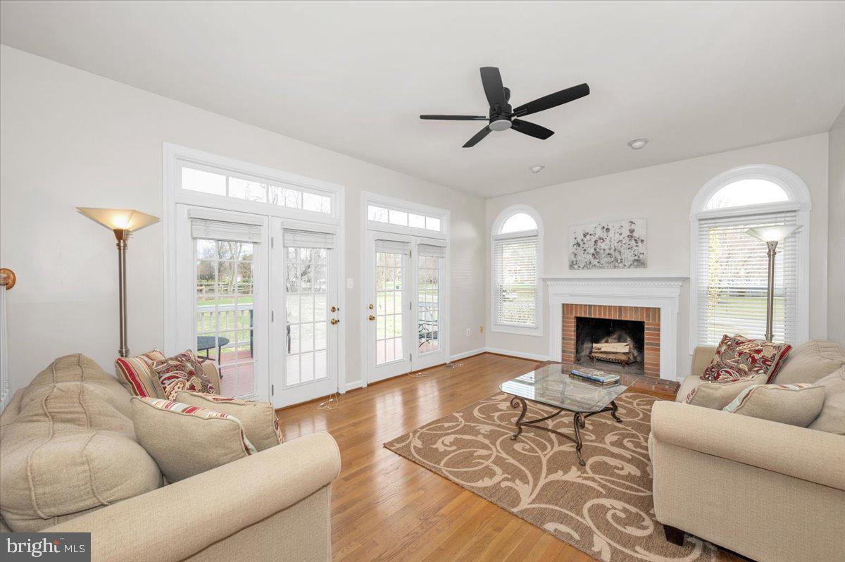 17900 Hickman Street Poolesville, MD 20837 - Photo 24 of 97 a living room with furniture and a fireplace