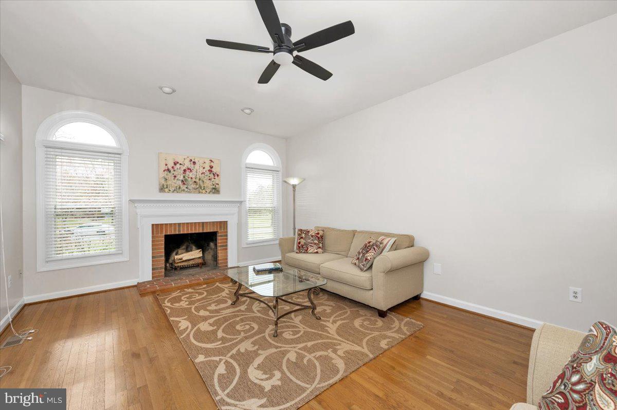 17900 Hickman Street Poolesville, MD 20837 - Photo 26 of 97 a living room with furniture and a fireplace