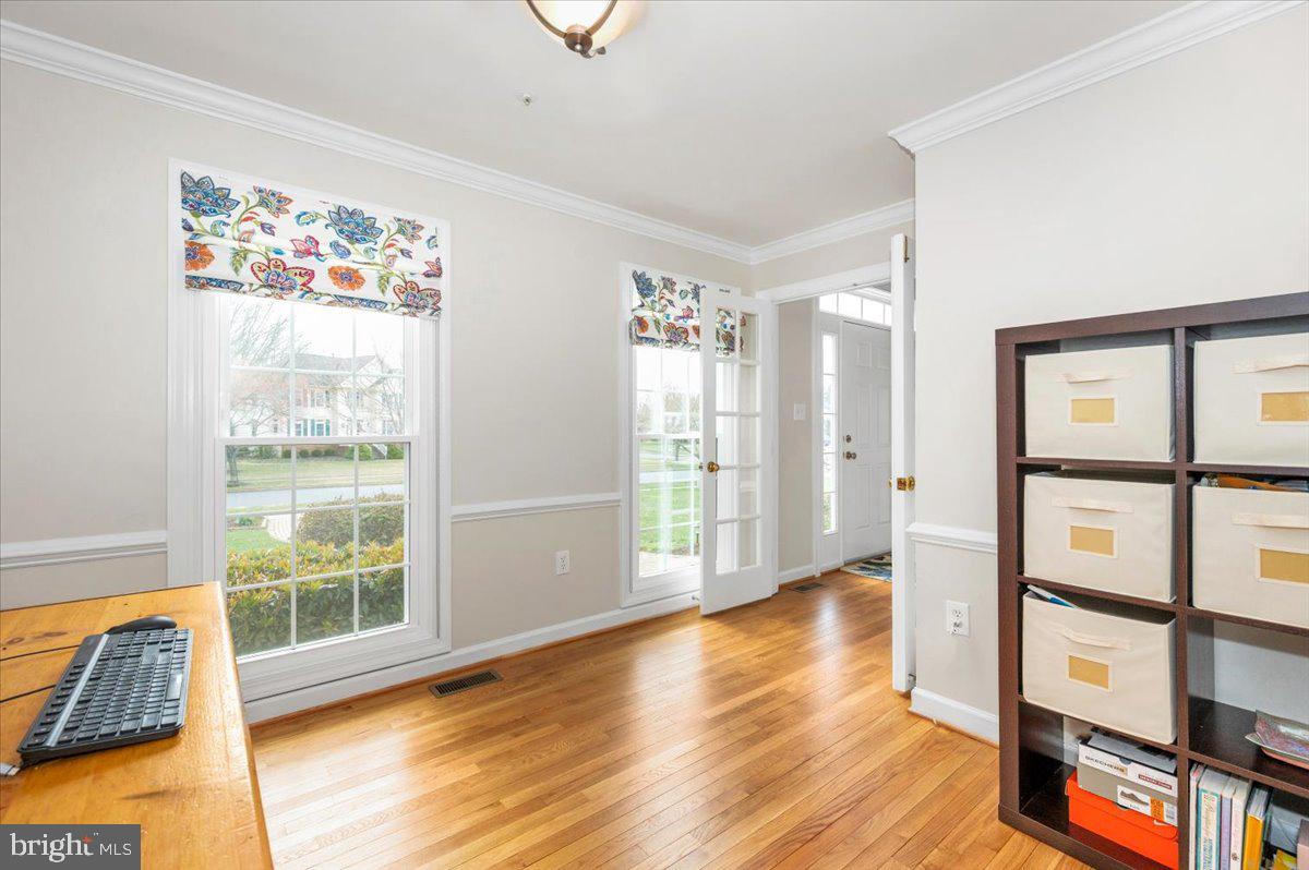 17900 Hickman Street Poolesville, MD 20837 - Photo 30 of 97 a view of an empty room with wooden floor and a window