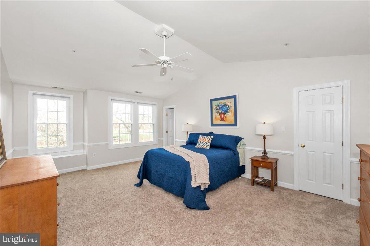 17900 Hickman Street Poolesville, MD 20837 - Photo 34 of 97 a spacious bedroom with a bed and a window