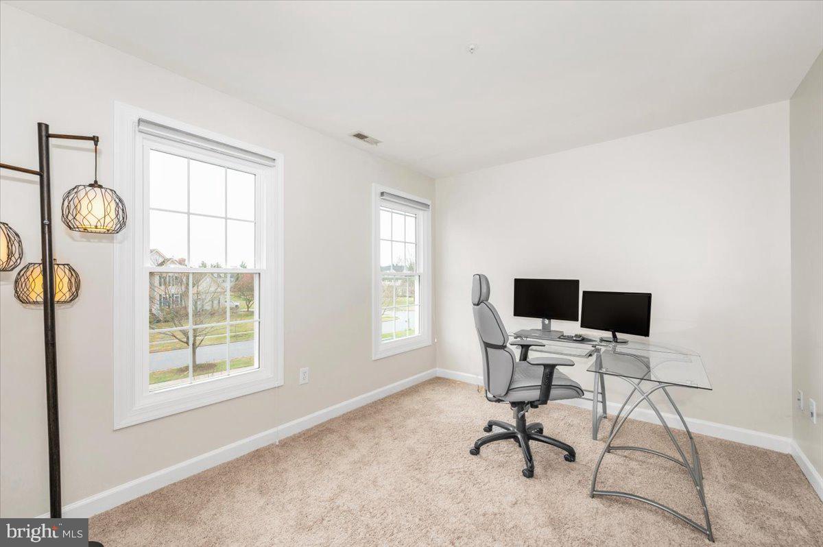 17900 Hickman Street Poolesville, MD 20837 - Photo 36 of 97 a view of a workspace with a window