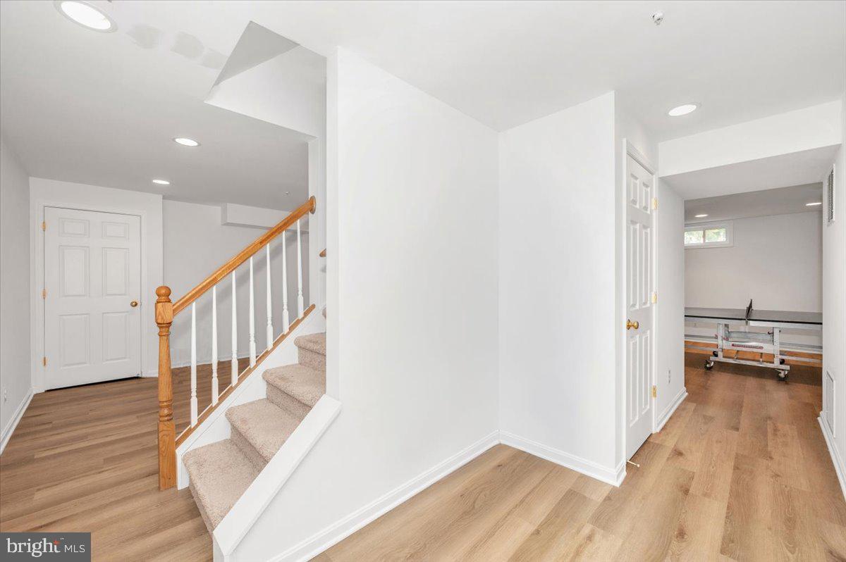 17900 Hickman Street Poolesville, MD 20837 - Photo 46 of 97 a view of entryway and hall with wooden floor