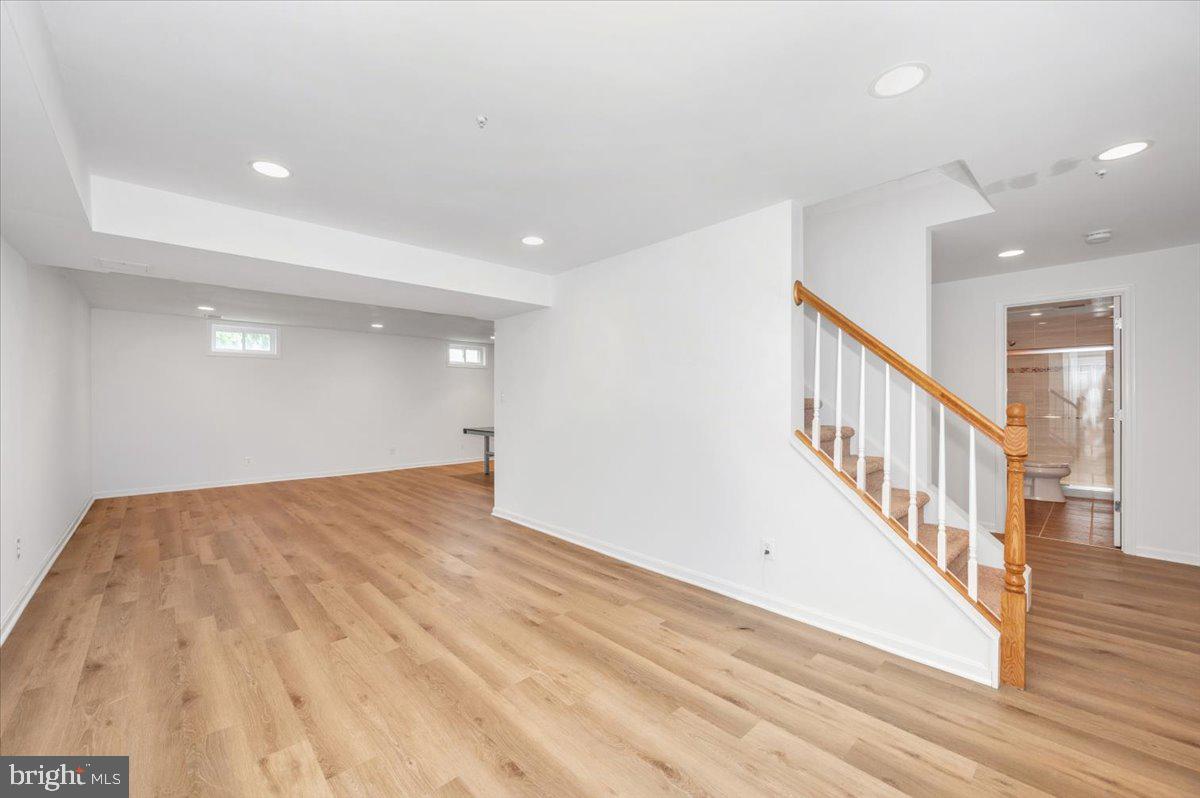 17900 Hickman Street Poolesville, MD 20837 - Photo 52 of 97 a view of an empty room with wooden floor
