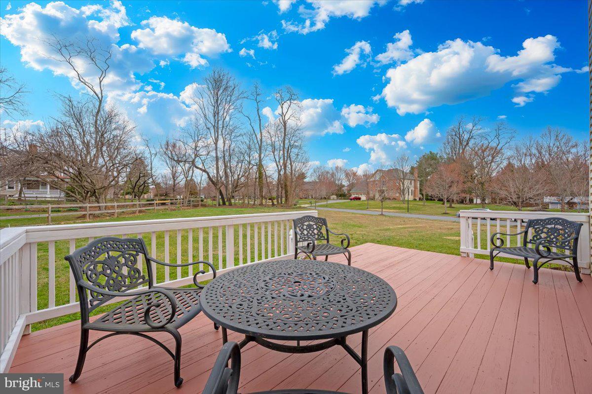 17900 Hickman Street Poolesville, MD 20837 - Photo 59 of 97 a view of a lake with table and chairs