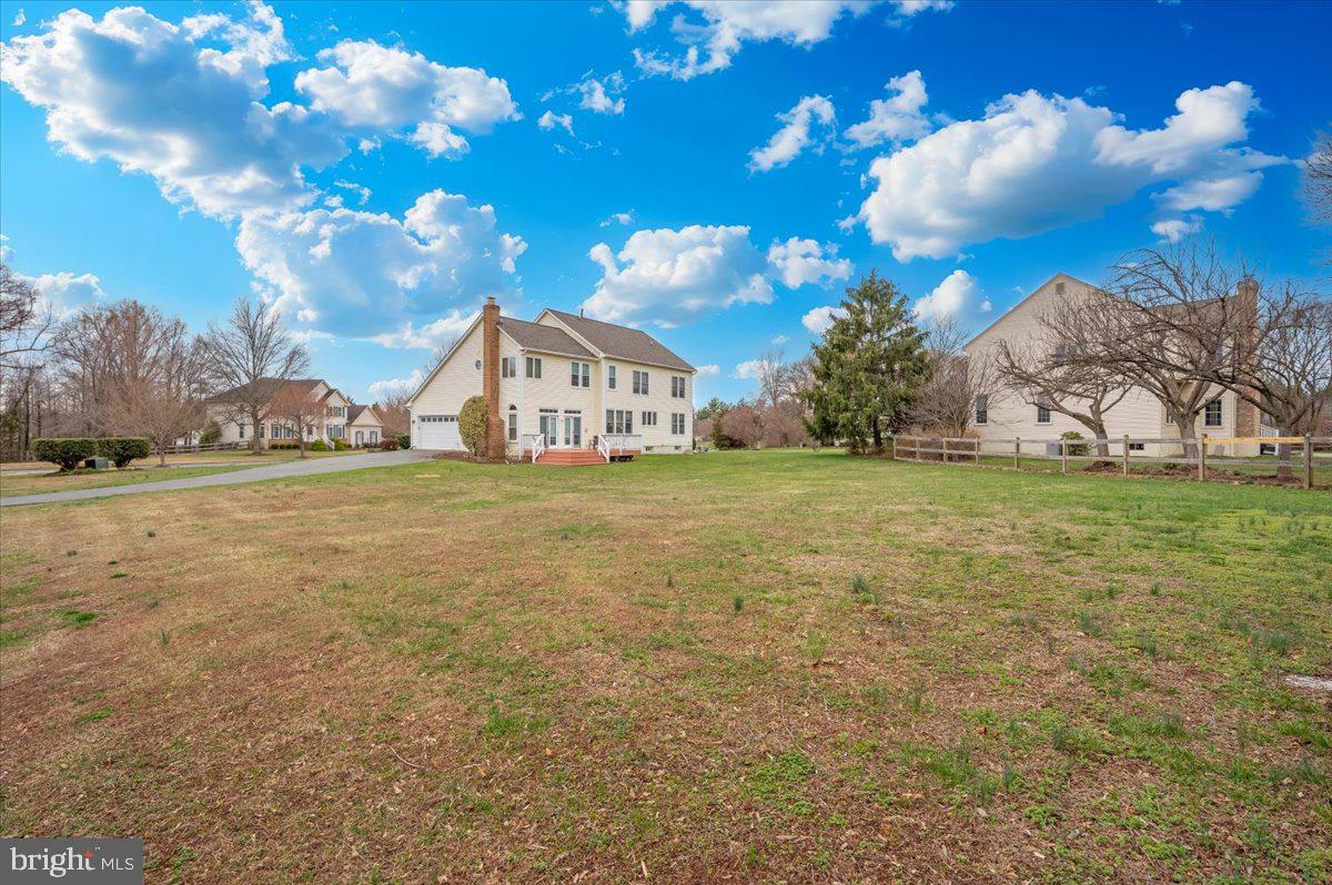 17900 Hickman Street Poolesville, MD 20837 - Photo 62 of 97 a view of a outdoor space with green field and trees