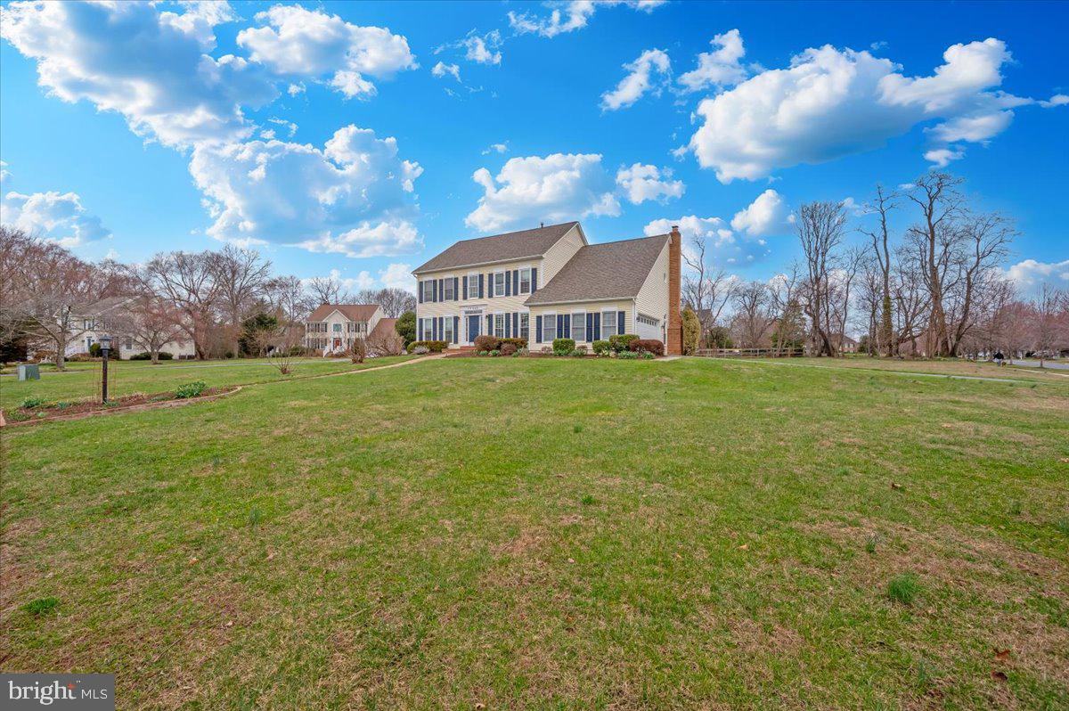 17900 Hickman Street Poolesville, MD 20837 - Photo 64 of 97 a view of a house with a yard