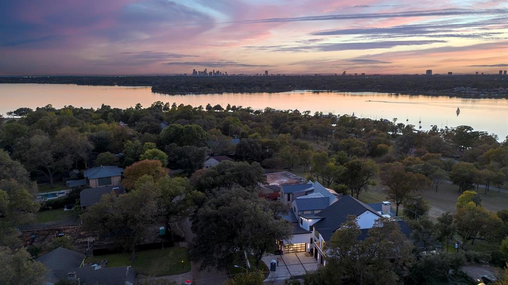9457 Waterview Road Dallas, TX 75218 - Photo 2 of 19 a view of a lake in middle of the town