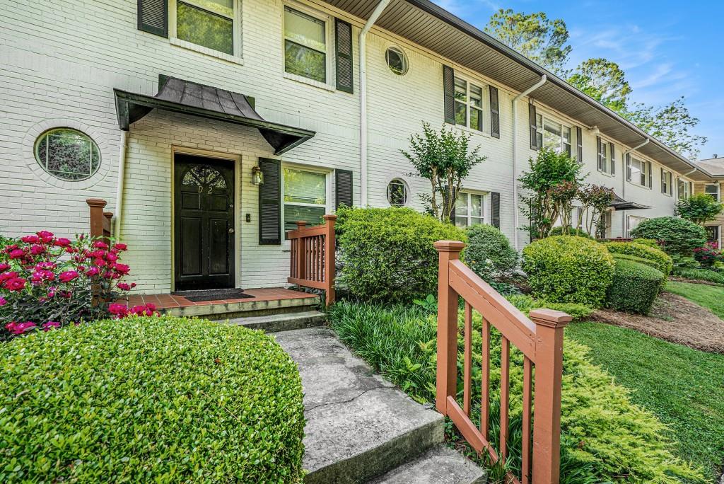 2477 North Decatur Road, Unit A1 Decatur, GA 30033 - Photo 1 of 29 a front view of a house with garden