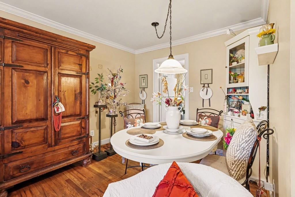 2477 North Decatur Road, Unit A1 Decatur, GA 30033 - Photo 12 of 29 a view of a dining room with furniture window and wooden floor