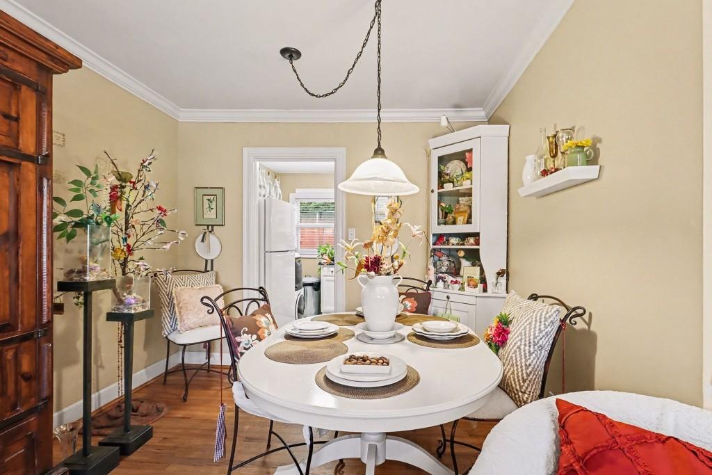 2477 North Decatur Road, Unit A1 Decatur, GA 30033 - Photo 13 of 29 a view of a dining room with furniture window and wooden floor