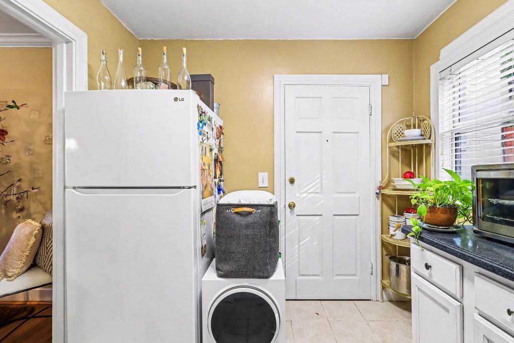 2477 North Decatur Road, Unit A1 Decatur, GA 30033 - Photo 16 of 29 a white refrigerator freezer sitting inside of a kitchen