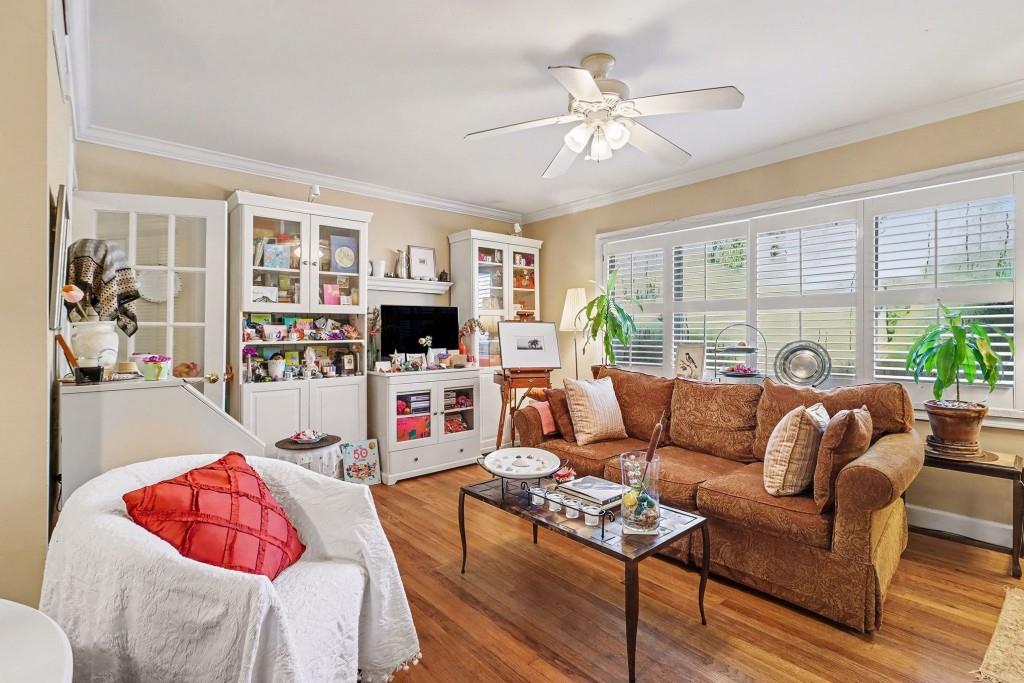 2477 North Decatur Road, Unit A1 Decatur, GA 30033 - Photo 2 of 29 a living room with furniture a flat screen tv and a large window