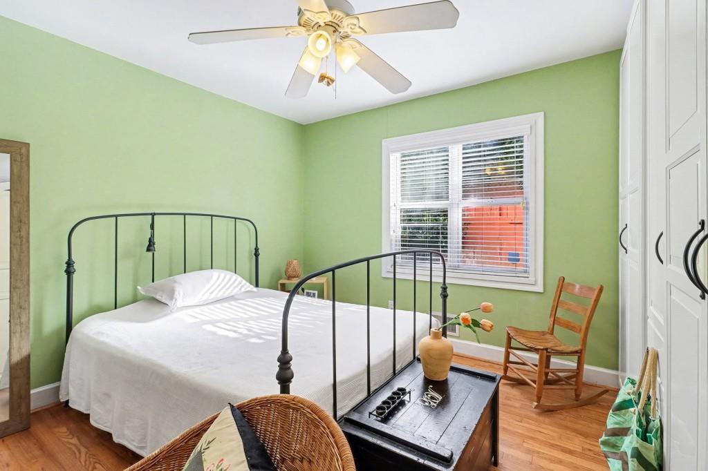2477 North Decatur Road, Unit A1 Decatur, GA 30033 - Photo 22 of 29 a bedroom with a bed a chandelier and a window