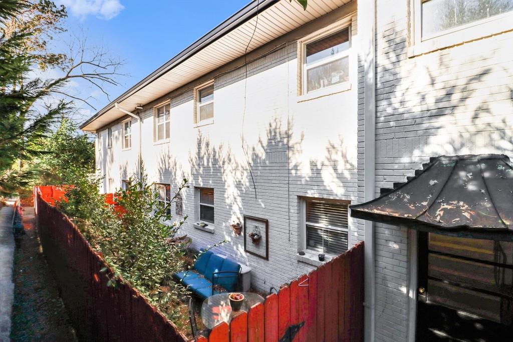2477 North Decatur Road, Unit A1 Decatur, GA 30033 - Photo 24 of 29 a view of a house with a potted plant ana a small yard