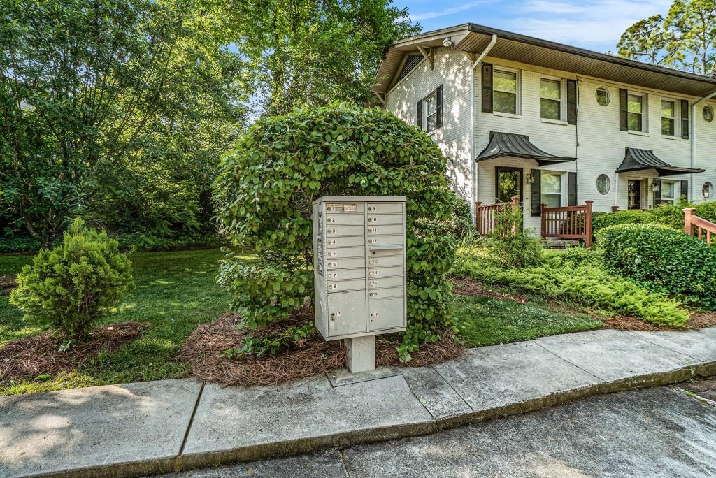 2477 North Decatur Road, Unit A1 Decatur, GA 30033 - Photo 26 of 29 a front view of a house with a yard and tree s