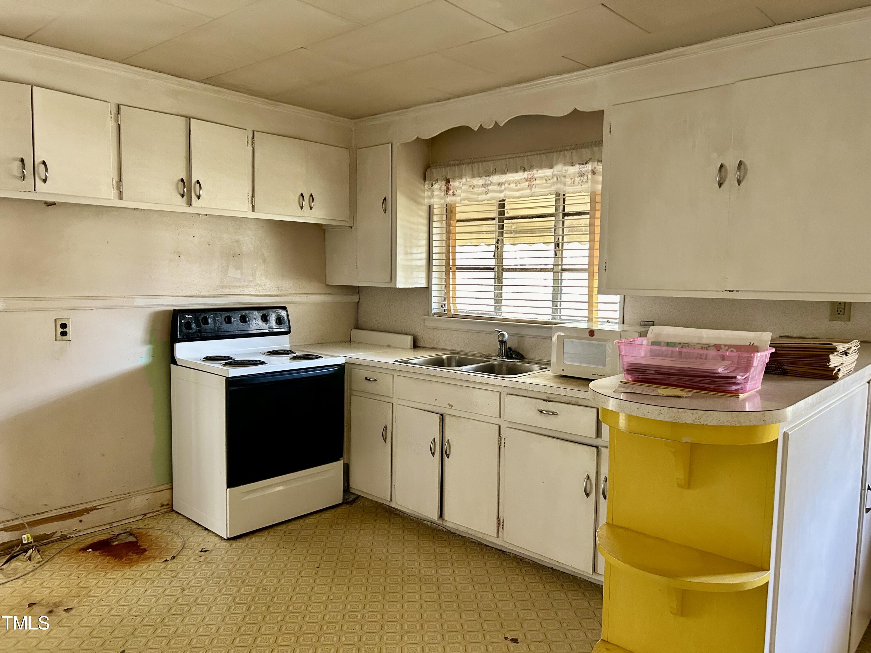 3526 Rose Of Sharon Road Durham, NC 27712 - Photo 3 of 11 a kitchen with a sink and cabinets