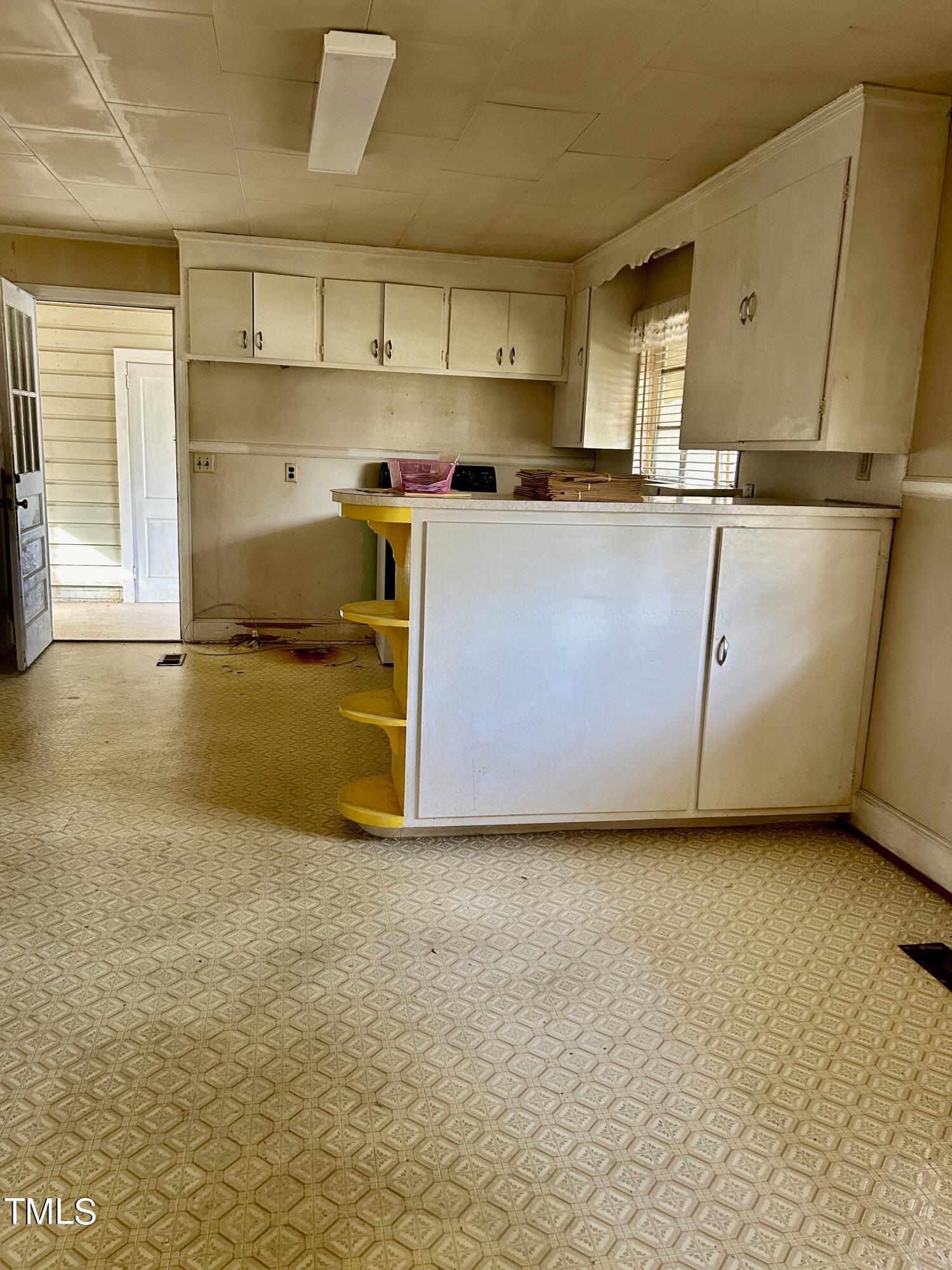 3526 Rose Of Sharon Road Durham, NC 27712 - Photo 4 of 11 a kitchen with stainless steel appliances a stove a sink and a refrigerator