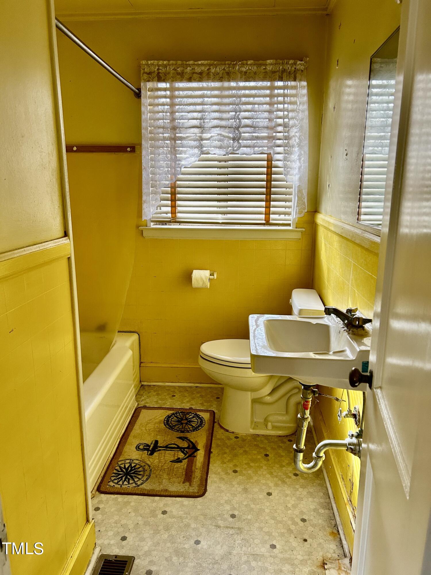 3526 Rose Of Sharon Road Durham, NC 27712 - Photo 7 of 11 a bathroom with a sink and a mirror