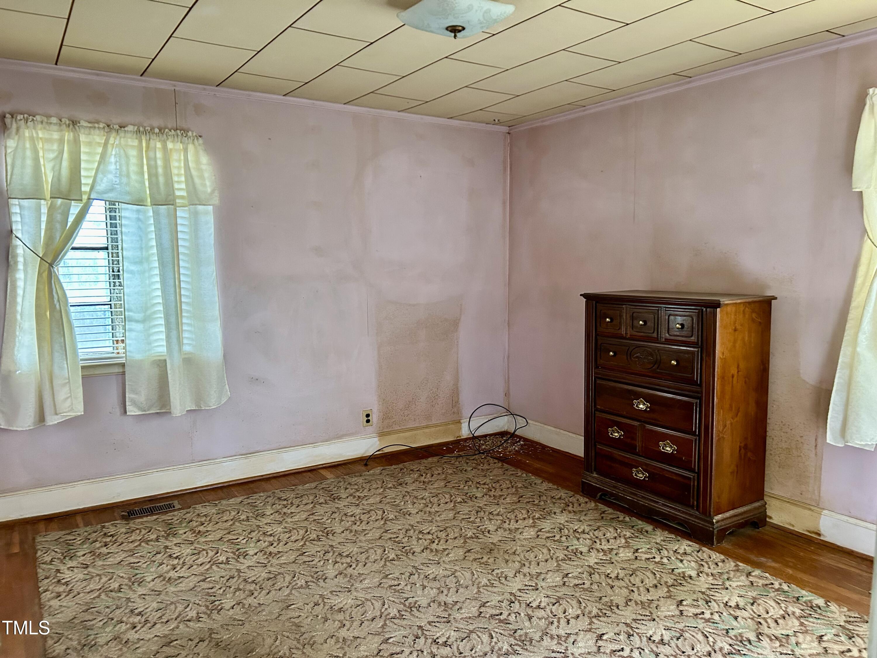 3526 Rose Of Sharon Road Durham, NC 27712 - Photo 9 of 11 a room with a dresser and a window