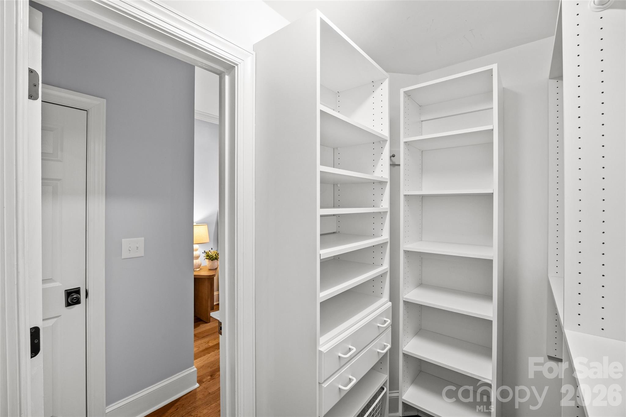 6029 Sharon Road Charlotte, NC 28210 - Photo 20 of 47 a view of walk in closet with empty racks