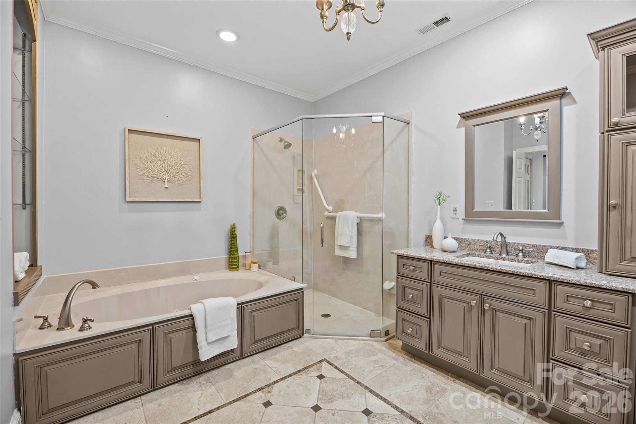 6029 Sharon Road Charlotte, NC 28210 - Photo 21 of 47 a bathroom with a tub sink and mirror