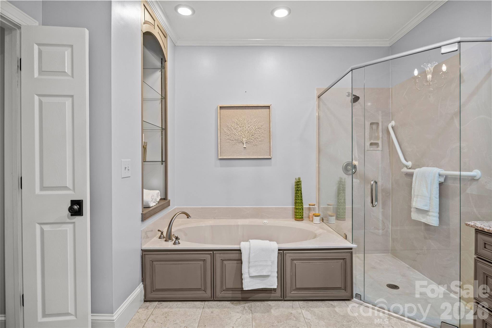 6029 Sharon Road Charlotte, NC 28210 - Photo 22 of 47 a bathroom with a tub and a shower