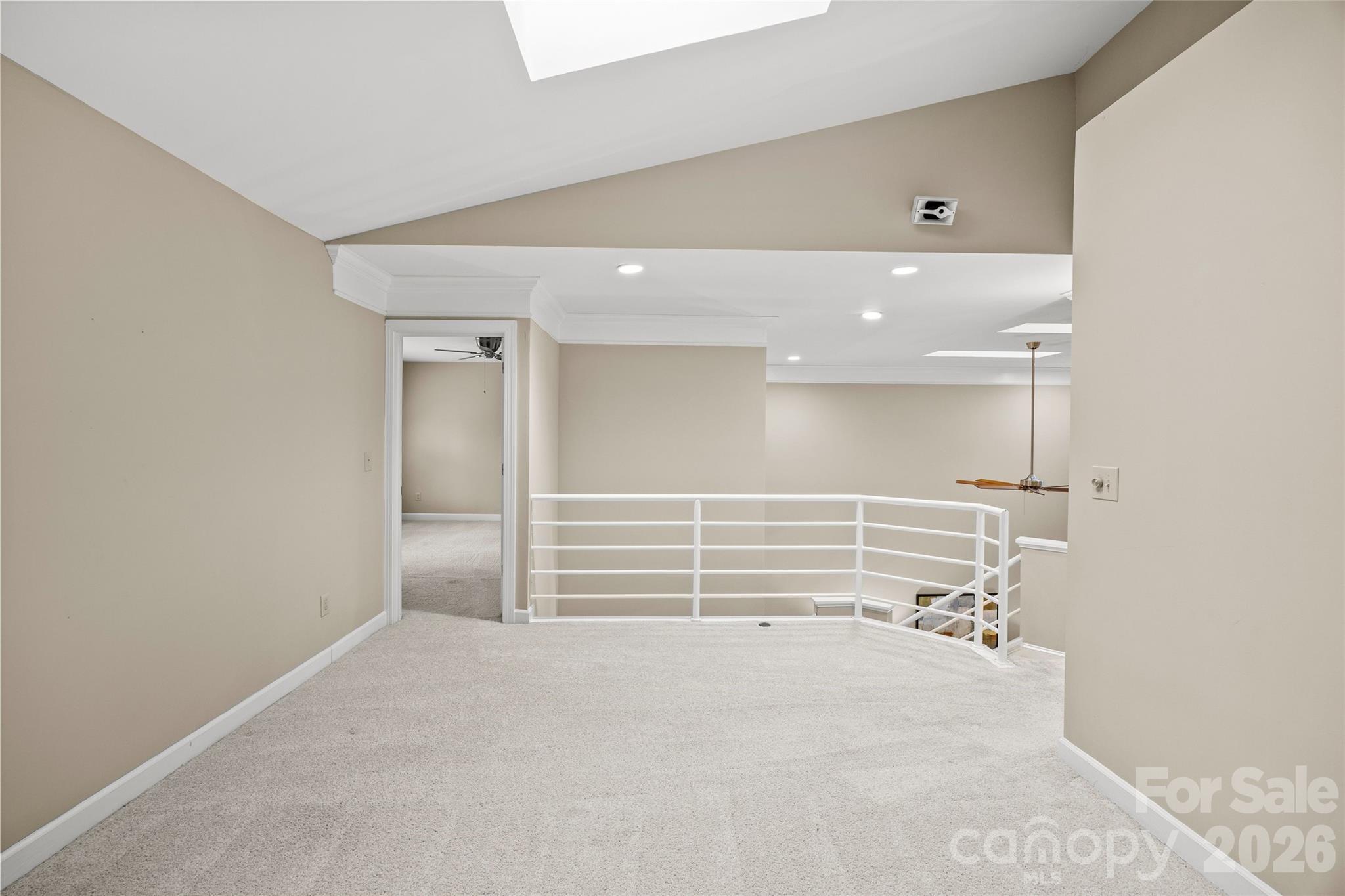 6029 Sharon Road Charlotte, NC 28210 - Photo 28 of 47 wooden floor in an empty room with a window