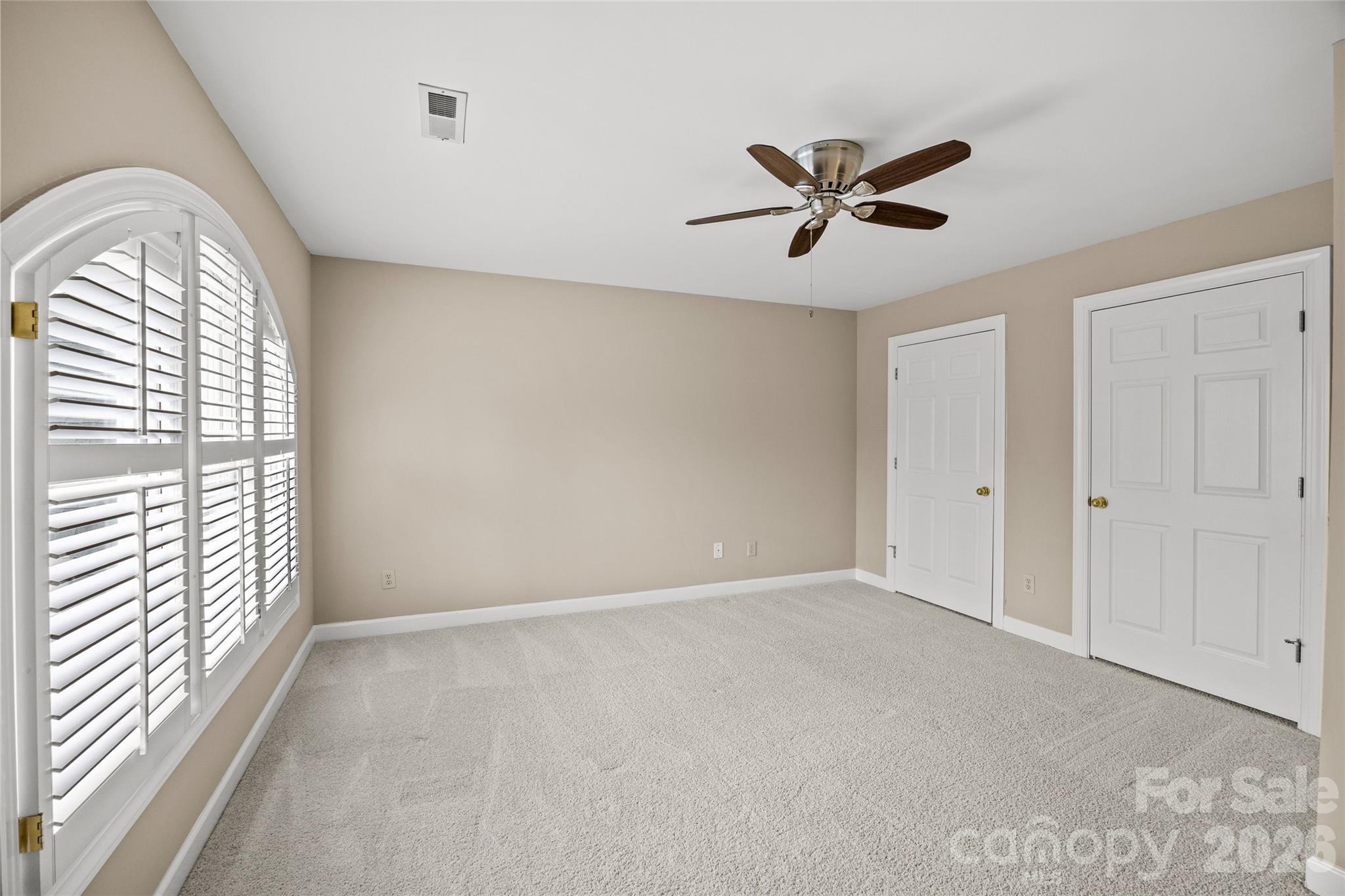 6029 Sharon Road Charlotte, NC 28210 - Photo 29 of 47 a view of a livingroom with a ceiling fan and window