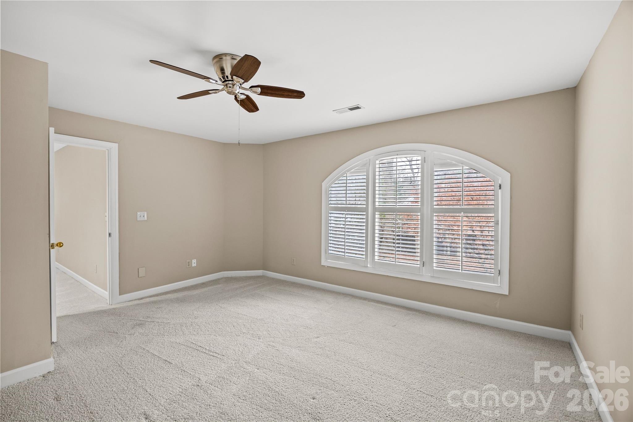 6029 Sharon Road Charlotte, NC 28210 - Photo 31 of 47 a view of an empty room with a window