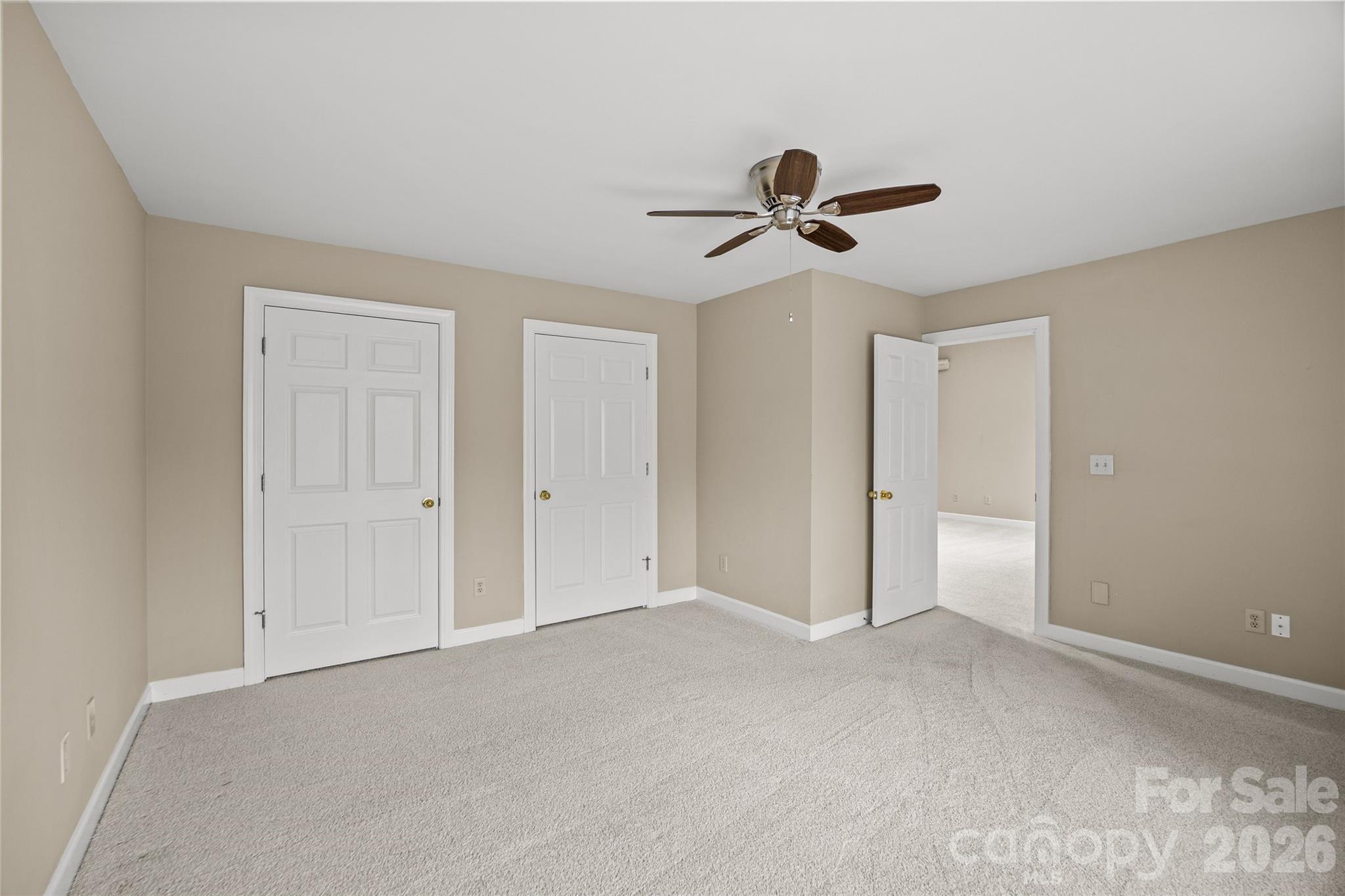 6029 Sharon Road Charlotte, NC 28210 - Photo 32 of 47 a view of a room with a ceiling fan