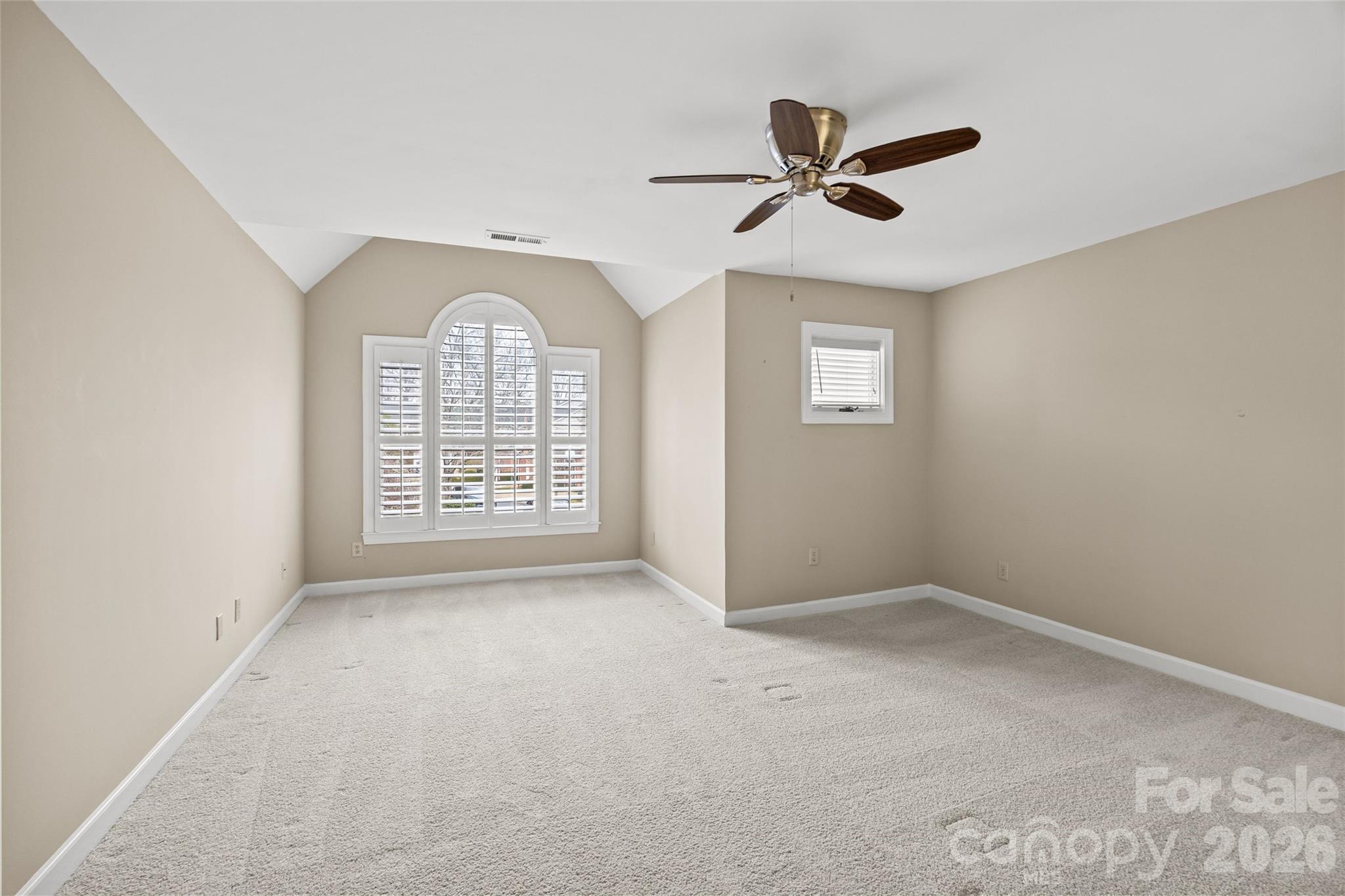 6029 Sharon Road Charlotte, NC 28210 - Photo 35 of 47 a view of an empty room with a window