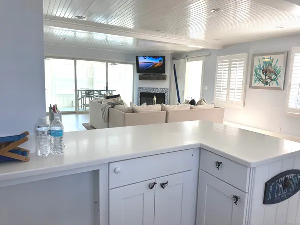 a kitchen with stainless steel appliances a stove microwave and refrigerator