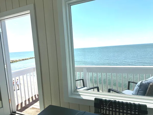 a view of a balcony with wooden floor