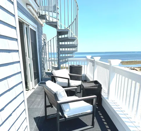 a view of a hallway with paintings on the wall