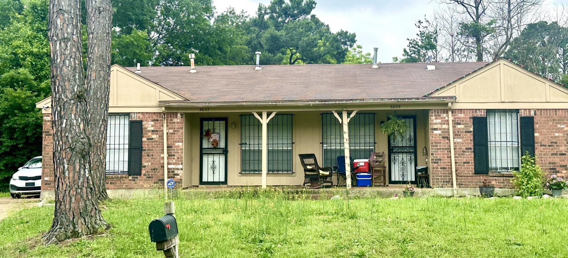 front view of a house with a yard