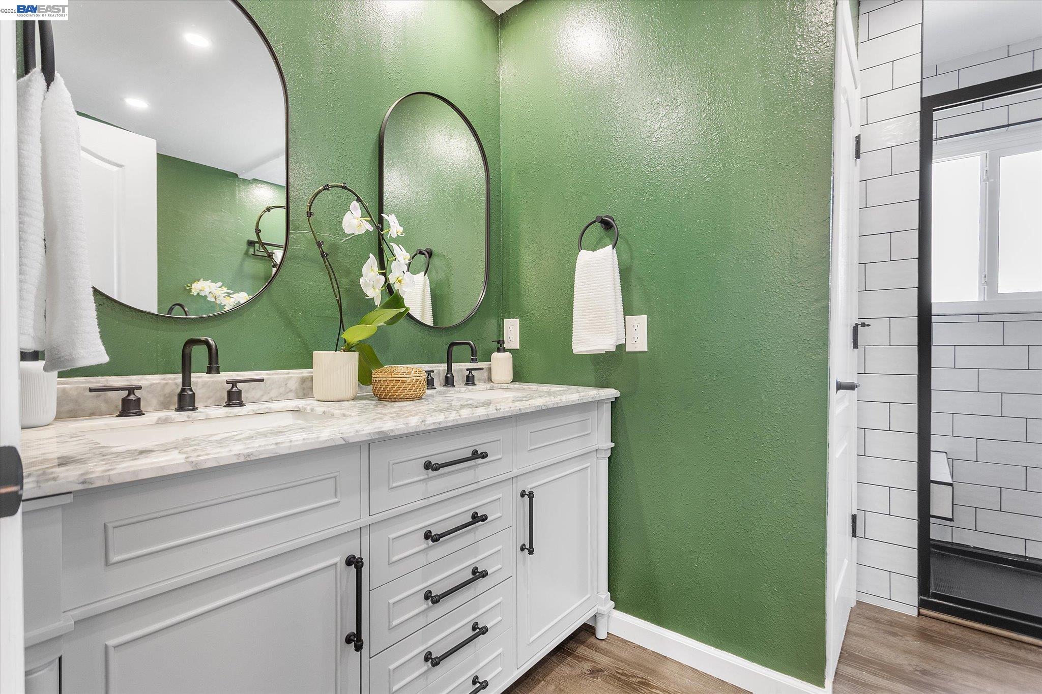 16683 Kildare Road Castro Valley, CA 94546 - Photo 51 of 77 a bathroom with a double vanity sink and a mirror