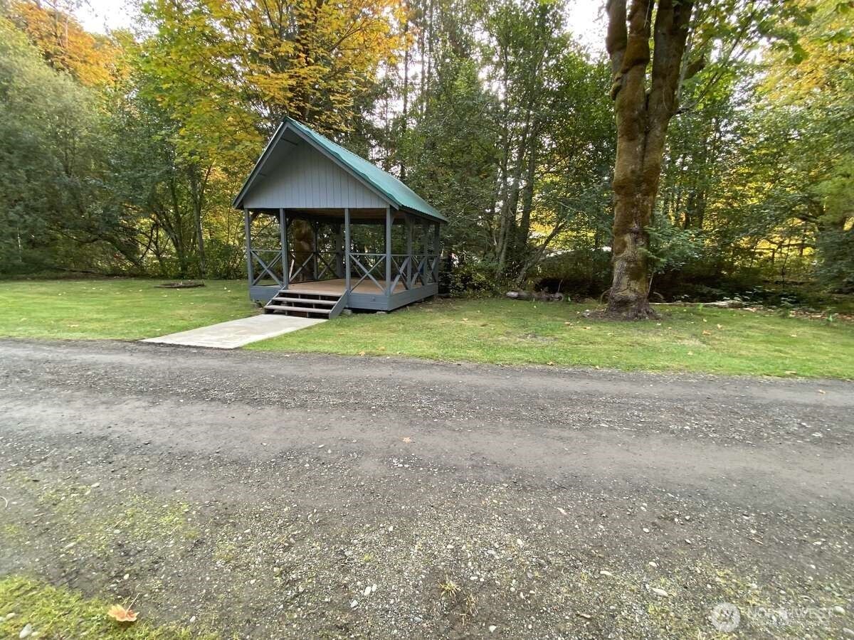 111 North Jorstad Creek Road Lilliwaup, WA 98555 - Photo 15 of 23 a front view of house with yard and green space