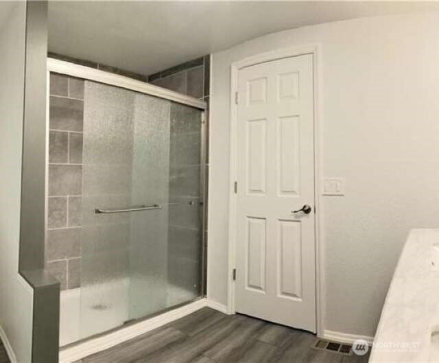 111 North Jorstad Creek Road Lilliwaup, WA 98555 - Photo 4 of 23 a bathroom with a glass shower door