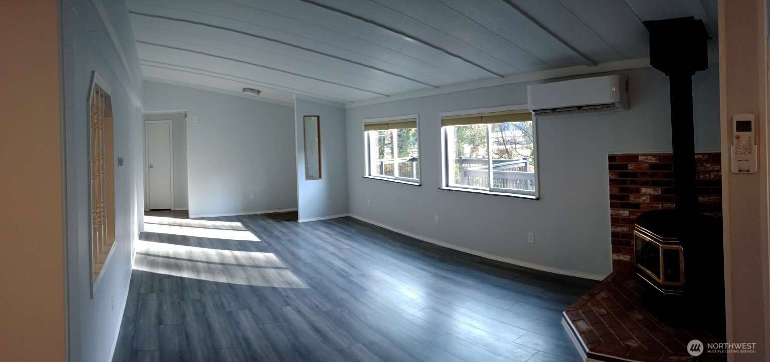 111 North Jorstad Creek Road Lilliwaup, WA 98555 - Photo 6 of 23 a view of an empty room and wooden floor