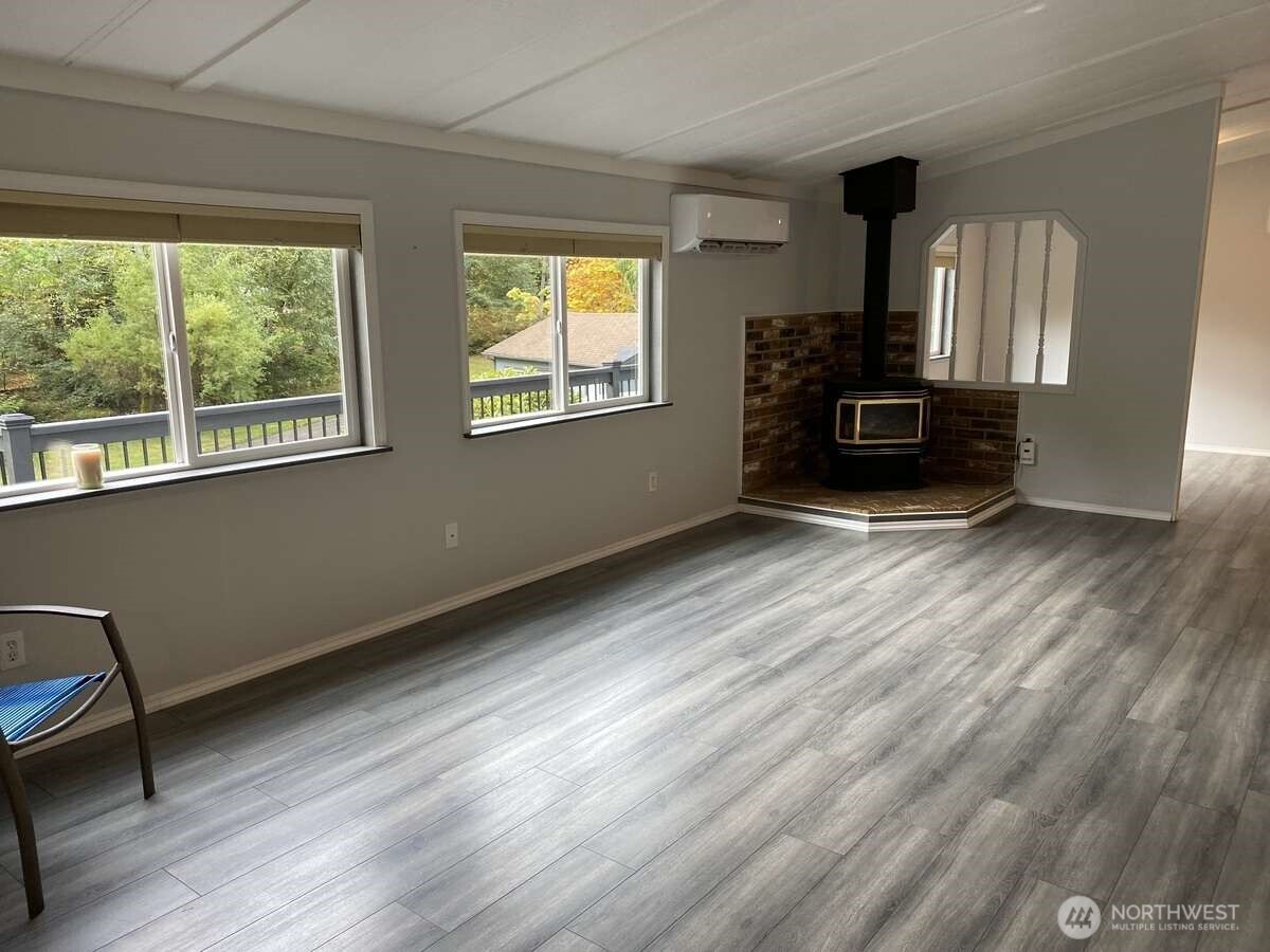 111 North Jorstad Creek Road Lilliwaup, WA 98555 - Photo 7 of 23 a view of a livingroom with a fireplace