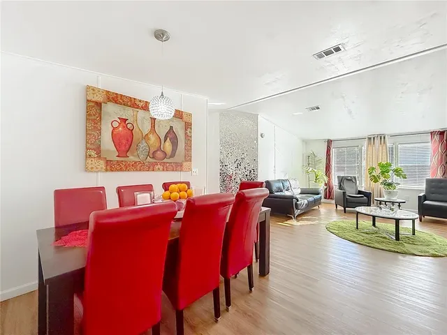 a kitchen with cabinets stainless steel appliances a sink and a stove